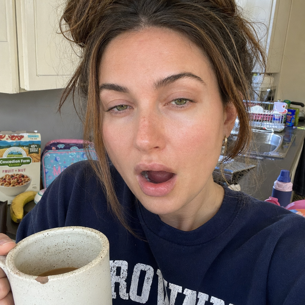 Day 1: Maya in her kitchen, mid-yawn, puffy